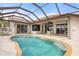 Relaxing kidney-shaped pool with screened enclosure at 5430 Almar Dr, Punta Gorda, FL 33950