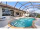 Relaxing kidney-shaped pool with screened enclosure at 5430 Almar Dr, Punta Gorda, FL 33950