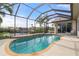 Relaxing kidney-shaped pool with screened enclosure at 5430 Almar Dr, Punta Gorda, FL 33950