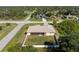 Aerial view of home showcasing the backyard and the screened lanai at 5991 Gillot Blvd, Port Charlotte, FL 33981