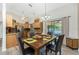 Welcoming dining room featuring wood table with seating for four and decorative chandelier at 5991 Gillot Blvd, Port Charlotte, FL 33981