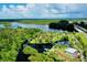 Aerial view of waterfront park with dock and walking trails at 6208 Keating Ave, North Port, FL 34291