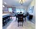 Dining area with a dark wood table and six chairs at 6208 Keating Ave, North Port, FL 34291