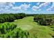 Aerial view of a beautifully landscaped golf course at 6208 Keating Ave, North Port, FL 34291