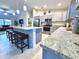 Modern kitchen with granite countertops and an island at 6208 Keating Ave, North Port, FL 34291