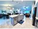 Open concept kitchen with island and granite countertops at 6208 Keating Ave, North Port, FL 34291