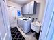 Bright laundry room with washer, dryer, and storage cabinets at 6208 Keating Ave, North Port, FL 34291