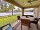 Enjoy your morning coffee in this screened patio with a view of the backyard at 6208 Keating Ave, North Port, FL 34291