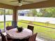 This screened patio offers a comfortable seating area and backyard access at 6208 Keating Ave, North Port, FL 34291