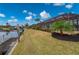 Landscaped backyard with canal access and dock at 674 Monaco Dr, Punta Gorda, FL 33950