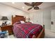 Bright bedroom with red plaid bedding and ceiling fan at 674 Monaco Dr, Punta Gorda, FL 33950