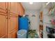 Laundry room with cabinets and blue washer at 674 Monaco Dr, Punta Gorda, FL 33950