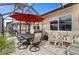 Covered patio with table and chairs, perfect for outdoor dining at 674 Monaco Dr, Punta Gorda, FL 33950