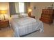 Comfortable bedroom with dresser and nightstands at 721 Brenda Ct, Punta Gorda, FL 33950