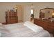 Bedroom with dresser and view of living room at 721 Brenda Ct, Punta Gorda, FL 33950