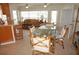 Open concept dining area with bamboo chairs and glass top table at 721 Brenda Ct, Punta Gorda, FL 33950