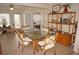 Bright dining area with bamboo chairs and glass top table at 721 Brenda Ct, Punta Gorda, FL 33950