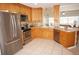 Kitchen with stainless steel appliances and light wood cabinets at 721 Brenda Ct, Punta Gorda, FL 33950