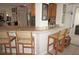 Breakfast bar with four stools in kitchen area at 721 Brenda Ct, Punta Gorda, FL 33950