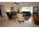 Living room with leather sofas, a large window, and an area rug at 721 Brenda Ct, Punta Gorda, FL 33950