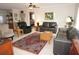 Living room with leather sofas, a large window, and an area rug at 721 Brenda Ct, Punta Gorda, FL 33950