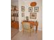 Home office with a wooden desk, chair, and decorative wall art at 721 Brenda Ct, Punta Gorda, FL 33950