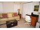 Comfortable office with a desk, chair, and relaxing sofa at 721 Brenda Ct, Punta Gorda, FL 33950