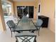 Outdoor patio with seating area and glass table at 721 Brenda Ct, Punta Gorda, FL 33950