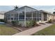 Screened pool area with brick walkway at 721 Brenda Ct, Punta Gorda, FL 33950