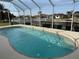 Enclosed kidney shaped pool with canal view at 721 Brenda Ct, Punta Gorda, FL 33950