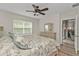 Bright bedroom with king-size bed and access to bathroom at 7249 W Lenox Cir, Punta Gorda, FL 33950