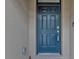 Dark blue front door with a modern, sleek design at 7249 W Lenox Cir, Punta Gorda, FL 33950