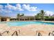 Relax by the community pool with lounge chairs at 7249 W Lenox Cir, Punta Gorda, FL 33950