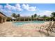 Community pool with shaded seating and lounge chairs at 7249 W Lenox Cir, Punta Gorda, FL 33950