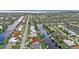 Aerial view of waterfront homes with private docks and lush landscaping at 820 Bal Harbor Blvd, Punta Gorda, FL 33950