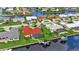 Aerial view of waterfront home with pool and private boat dock at 820 Bal Harbor Blvd, Punta Gorda, FL 33950