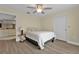 Cozy bedroom with ceiling fan, window and view of kitchen at 820 Bal Harbor Blvd, Punta Gorda, FL 33950