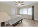 Comfortable bedroom with ceiling fan and large window at 820 Bal Harbor Blvd, Punta Gorda, FL 33950