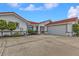 House exterior showcasing a two-car garage and well-manicured landscaping at 820 Bal Harbor Blvd, Punta Gorda, FL 33950