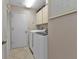 Convenient laundry room with washer, dryer, and extra storage at 820 Bal Harbor Blvd, Punta Gorda, FL 33950