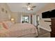 Large main bedroom with a ceiling fan and access to the patio at 820 Bal Harbor Blvd, Punta Gorda, FL 33950