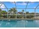 Refreshing pool with screened enclosure and water view at 820 Bal Harbor Blvd, Punta Gorda, FL 33950