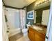 Clean bathroom with shower/tub combo and granite vanity at 93 Vivante Blvd # 9325, Punta Gorda, FL 33950