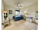 Cozy bedroom featuring a double bed, ceiling fan, and ample natural light at 93 Vivante Blvd # 9325, Punta Gorda, FL 33950