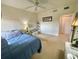 Bright bedroom with double bed, ceiling fan, and a view from window at 93 Vivante Blvd # 9325, Punta Gorda, FL 33950