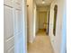 Clean hallway with tile floors and access to other rooms at 93 Vivante Blvd # 9325, Punta Gorda, FL 33950