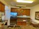 Modern kitchen with granite island and wood cabinets at 93 Vivante Blvd # 9325, Punta Gorda, FL 33950