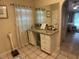 Vanity with granite countertop and large mirror in bathroom at 25332 Vantage Ln, Punta Gorda, FL 33983