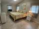 Spacious bedroom with king-size bed and ensuite bathroom at 25332 Vantage Ln, Punta Gorda, FL 33983