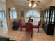 Dining area with red chairs and a glass table at 25332 Vantage Ln, Punta Gorda, FL 33983